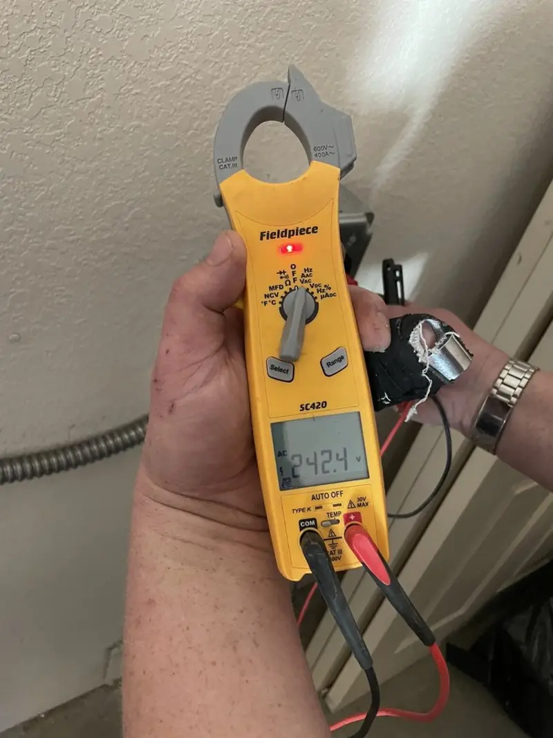 Voltage testing with clamp meter during Recessed Lighting Installation in Norristown
